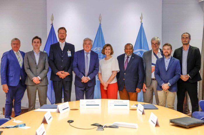 Beth Bechdol, FAO Deputy Director-General, and Carlo Lambro, CEMA Vice President stand for a group photo at the end of the FAO/CEMA Signing ceremony at the FAO headquarters